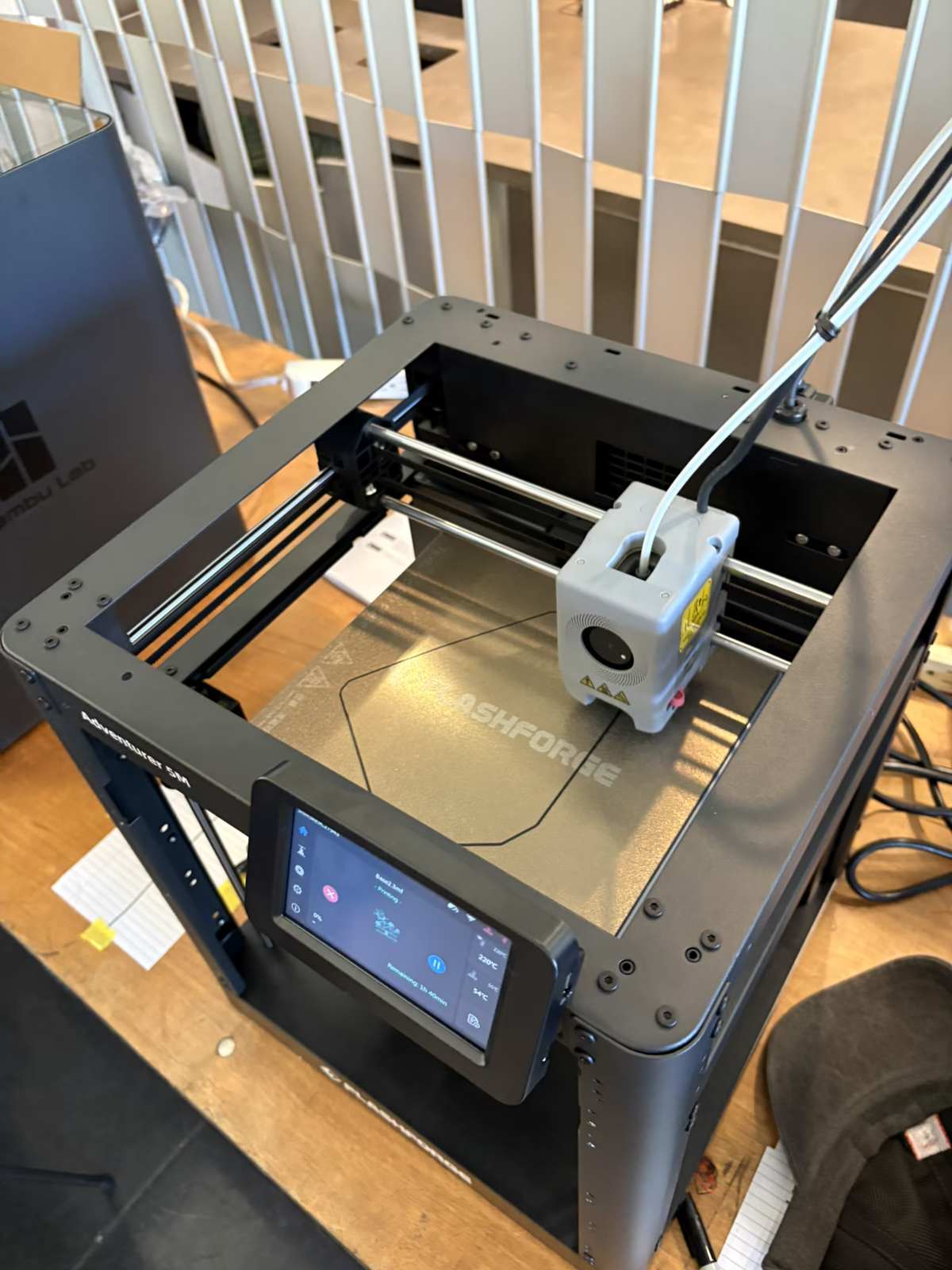 An Ankermake 3D printer printing robot arm parts
